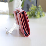 ピンクのパイソン蛇革財布の横側|超軽量で大容量な二つ折り財布